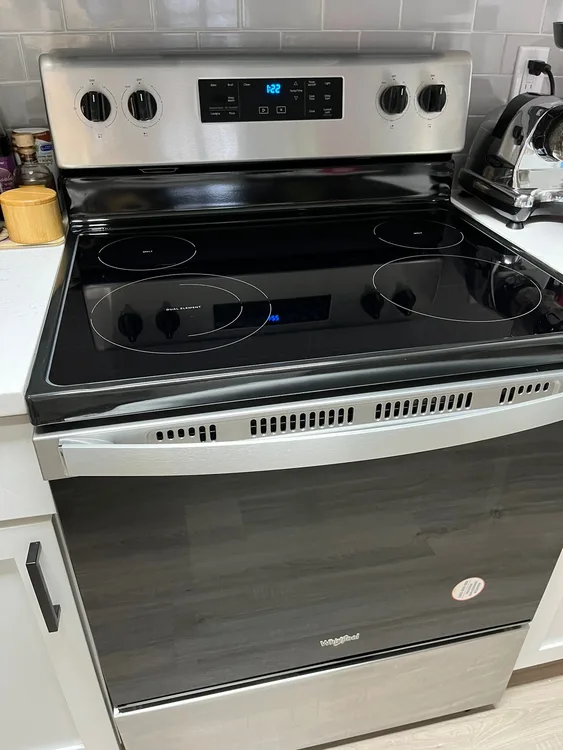 Modern kitchen with clean range and counters after one-time house cleaning in the Triangle, NC — Ever Clean House